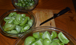 Cut and divide your green tomatoes